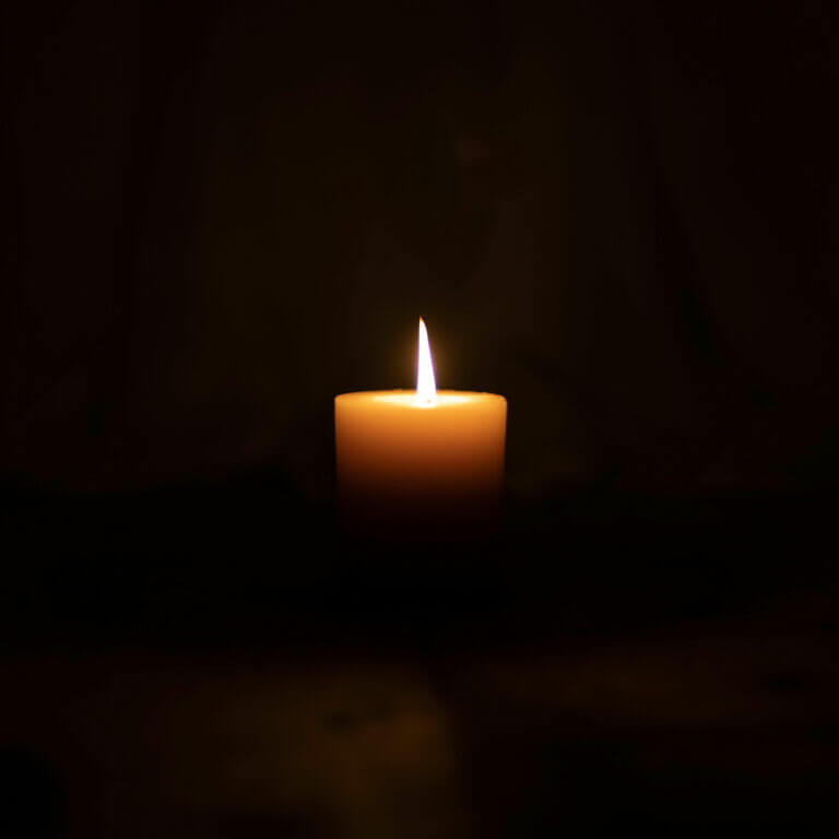 Lighted candle in memory of a lost loved one